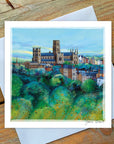 Greeting card with lush green surface of trees and Durham Cathedral standing proudly in background..