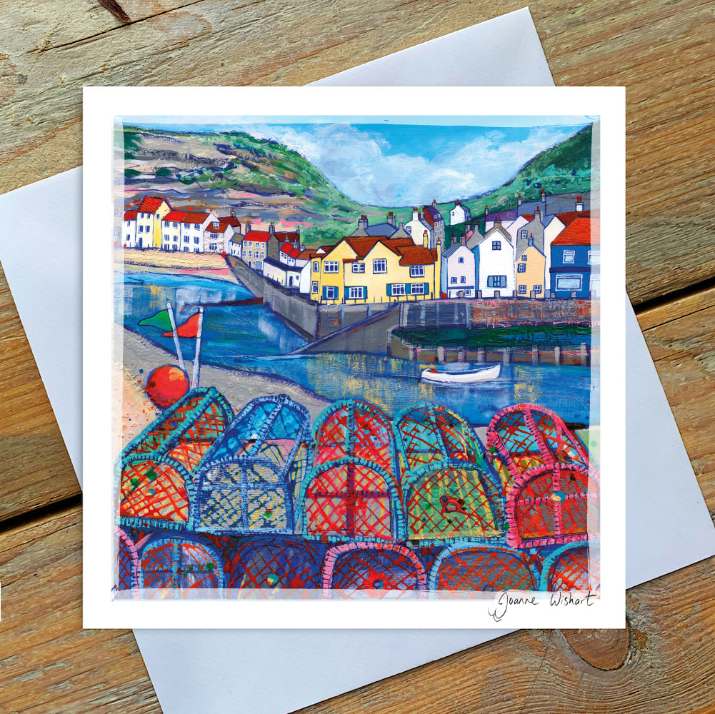 A colourful greetings card featuring a vibrant painting of the cod and losyter pub in Staithes with lobster pots in the foreground.