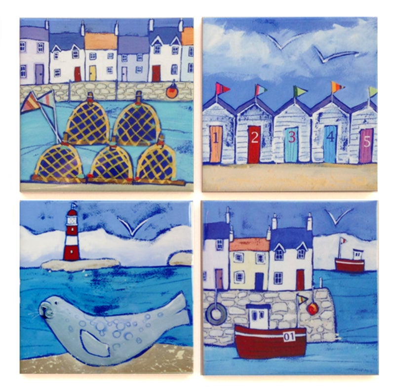 Set of 4 seaside ceramic coasters featuring colourful houses seals, fishing boats and beach huts.