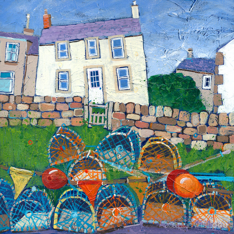 A print of a white fishermans cottage in Craster with a pile of lobster pots in the foreground.