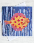 A quirky greetings card featuring a spotty plaice fish swimming through the sea weed.