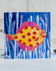 A greetings card featuring a happy plaice spotty fish swimming through sea weed.