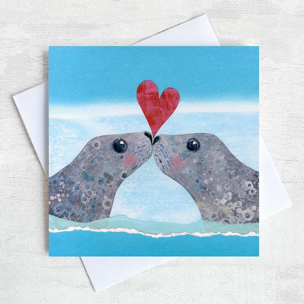 Seals kissing on a valentines greetings card