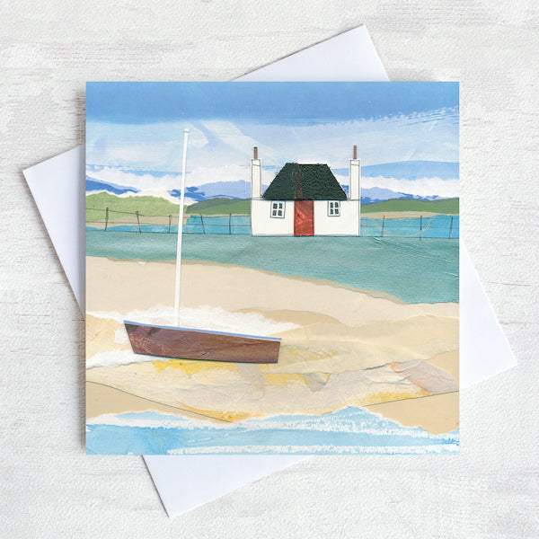 A scottish greetings card featuring a blackhouse cottage on a shore with a boat on the beach. 