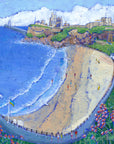 A print of Tynemouth priory with King Edwards bay below and purple flowers in the foreground.