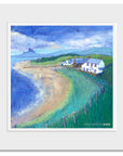 A mounted print of Low Newton beach in northumberland featuring the white national trust cottages on a summers day.