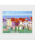 A mounted print of Pittenweem in Fife, with orange rooftops and waving on the line.
