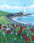 A print of St Mary's Lighthouse with a field of wildflowers in the foreground.