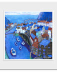 A mounted print of Staithes village.
