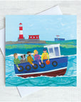 A quirky fishing boat bobs on the sea infront of a red and white lighthosue. There are 4 people and a dog on board the boat trip.