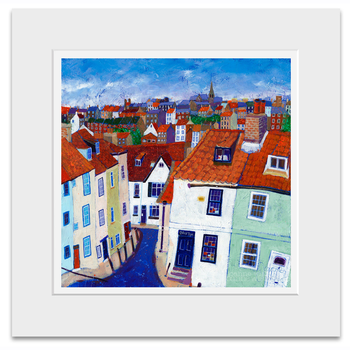 A mounted print of Whitby rooftops.