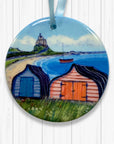 Decorative ornament with a scenic design of Boats sheds on a Lindisfarne background