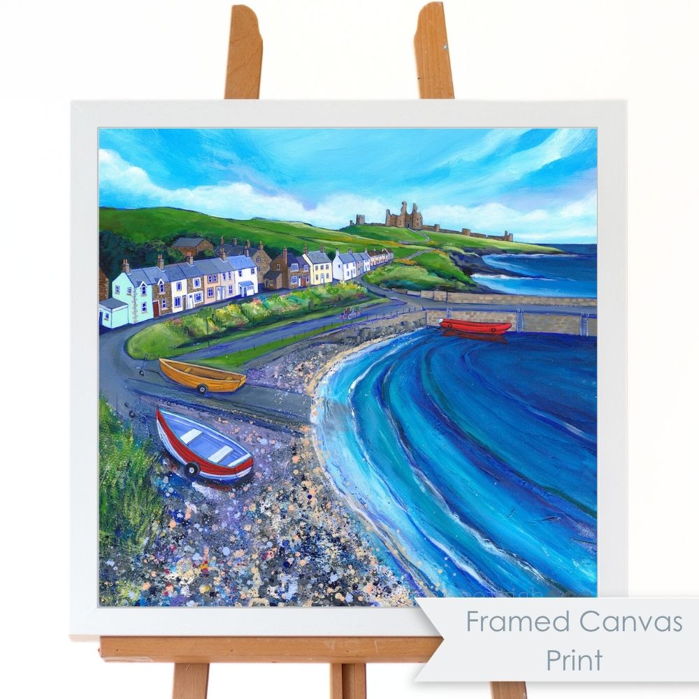 A bright colourful painting of a harbour village in a white frame.
