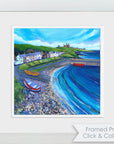 A bright colourful painting of a harbour village in a white woodwash frame, available for click and collect.