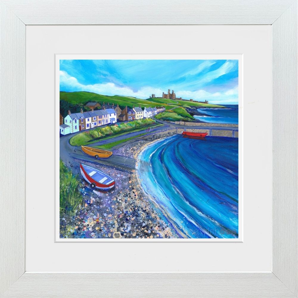 A bright colourful painting of a harbour village in a white woodwash frame