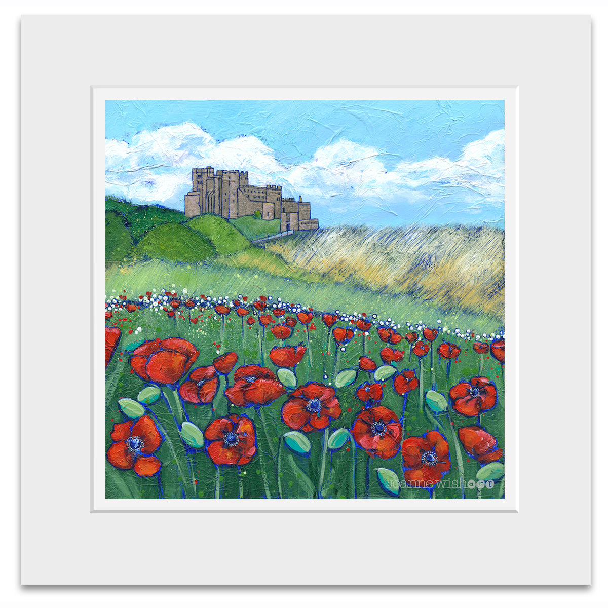 A mounted print of bamburgh castle with a swathe of bright red poppies in the dunes .