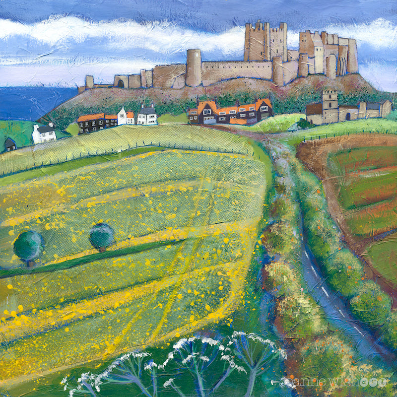 A striking painting of Bamburgh Castle with bright yellow flowered fields in the foreground and road sweeping into the village. 