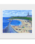 A mounted print of Cullercoats Bay with the lifeboat on the water.