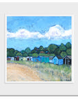 A mounted print of beach huts on Coldingham Bay sands.