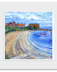 A mounted print of Beadnell Bay featuring sailing boats and the Lime kilns. 