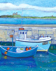 A fine art print of Beadnell harbour fishing boats with Dunstanburgh Castle in the distance.