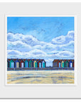 A mounted art print of Blyth beach huts.