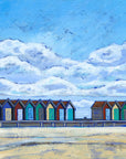 A fine art print of a row of colourful beach huts on Blyth beach.