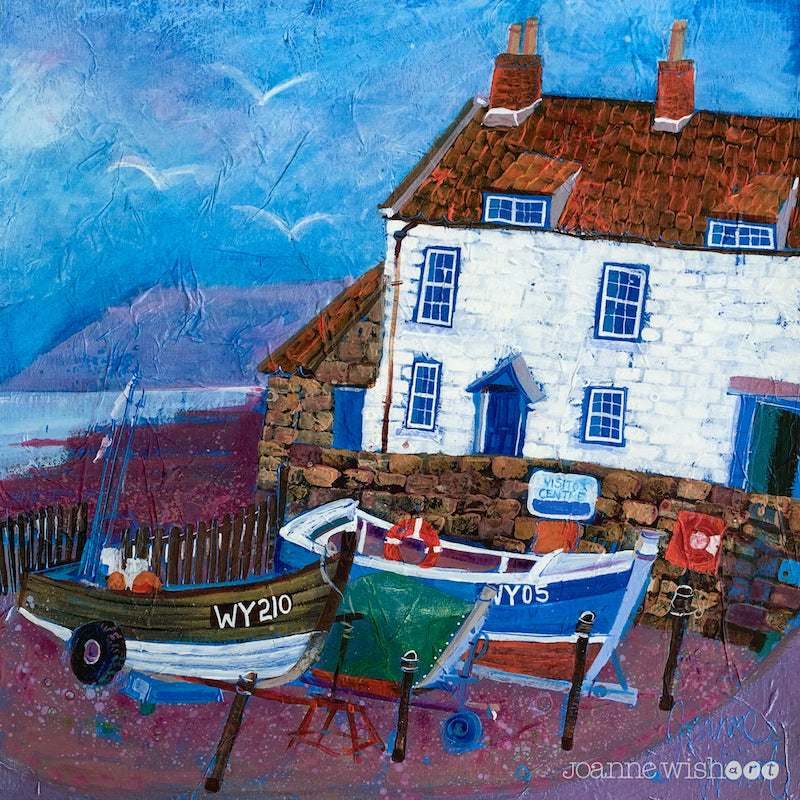 A charming fine art print of a fishermans cottage and coble boats at Robins hood Bay.