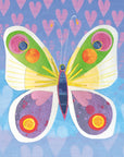 A colorful card with a symmetrical butterfly as the main focus. The butterfly has a blue body with a pink outline as well as big white wings with yellow detailing. The top part of the wing has green embellishments whereas the bottom has purple with fun heart shaped features. The background is multi toned blue, purple and pink with hearts underlaid. 