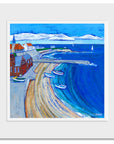 A mounted art print of Culelrcoats Bay featuring the RNLI lifeboat station and a cluster of coble boats.