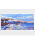 A mounted print of Cullercoats with a dramatic winter sky.