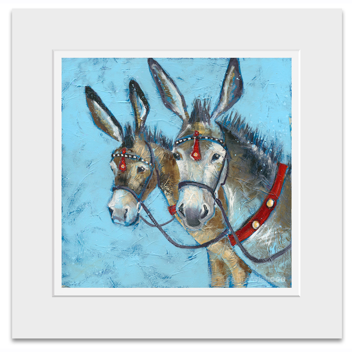 A mounted print of two seaside donkey heads with their ears pricked.