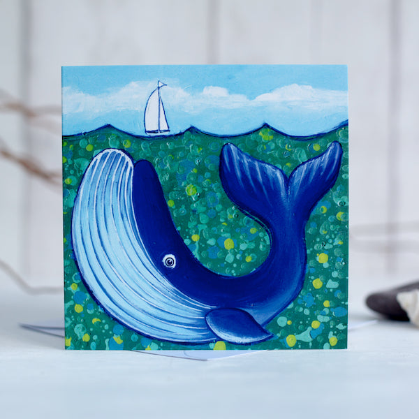 A charming greetings card from an original painting by Joanne Wishart, this joyous nautical picture features a big blue whale under a teal green sea. 