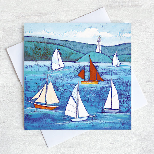 A cornish greetings card featuring sailing boats on a blue sea.