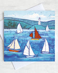 A cornish greetings card featuring sailing boats on a blue sea.