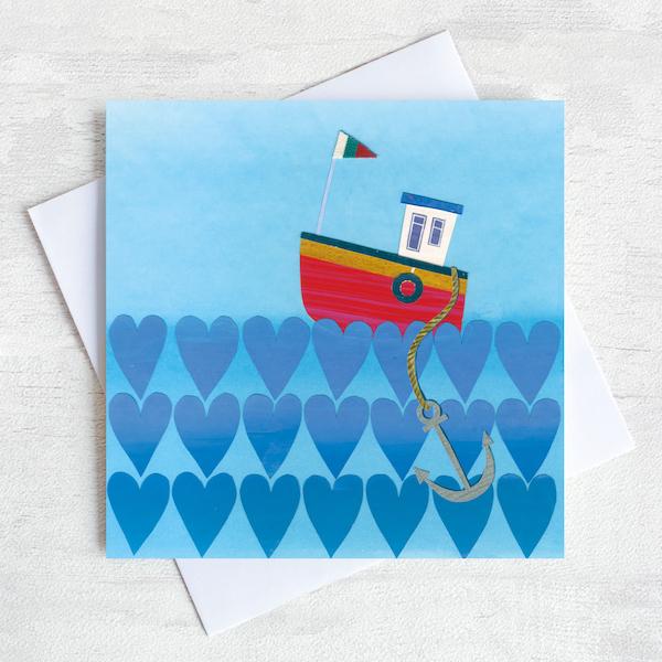 Valentines greetings card featuring a fishing boat on a sea of hearts