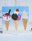 A coastal greetings card featuring 3 delicious ice creams with a chocolate flack and monkeys blood.