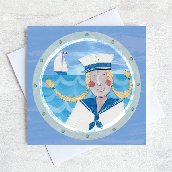 A nautical greetings card featuring a sailor girl with blond pigtails.