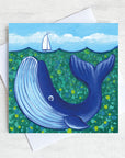 A charming greetings card from an original painting by Joanne Wishart, this joyous nautical picture features a big blue whale under a teal green sea. 