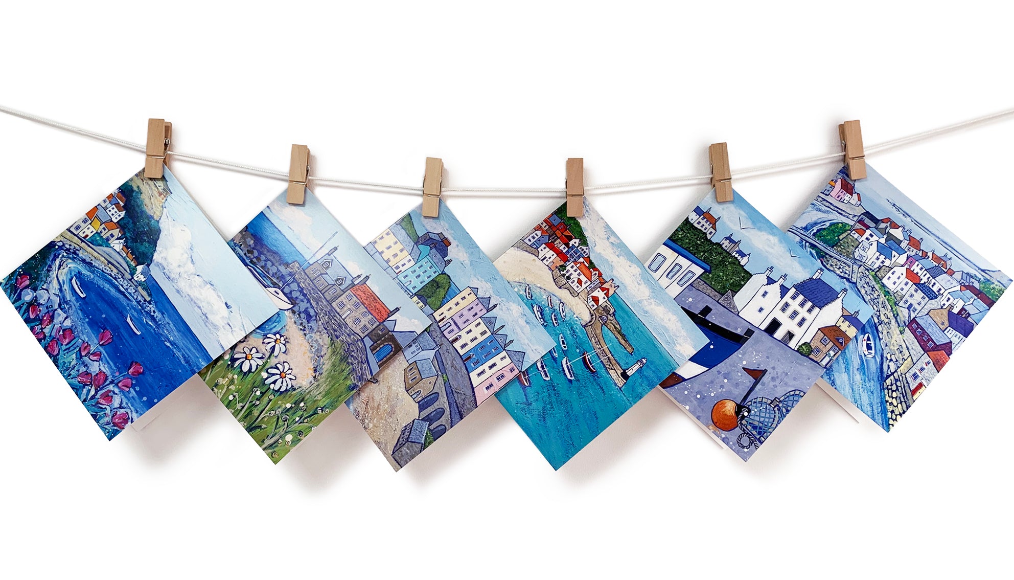 A collection of 6 greetings cards featuring harbour paintings by artist Joanne Wishart.