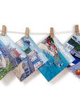 A collection of 6 greetings cards featuring harbour paintings by artist Joanne Wishart.
