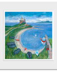 A mounted print of Holy Island Castle in Northumberland with upturned boats in the bay. Painted by local artist Joanne Wishart