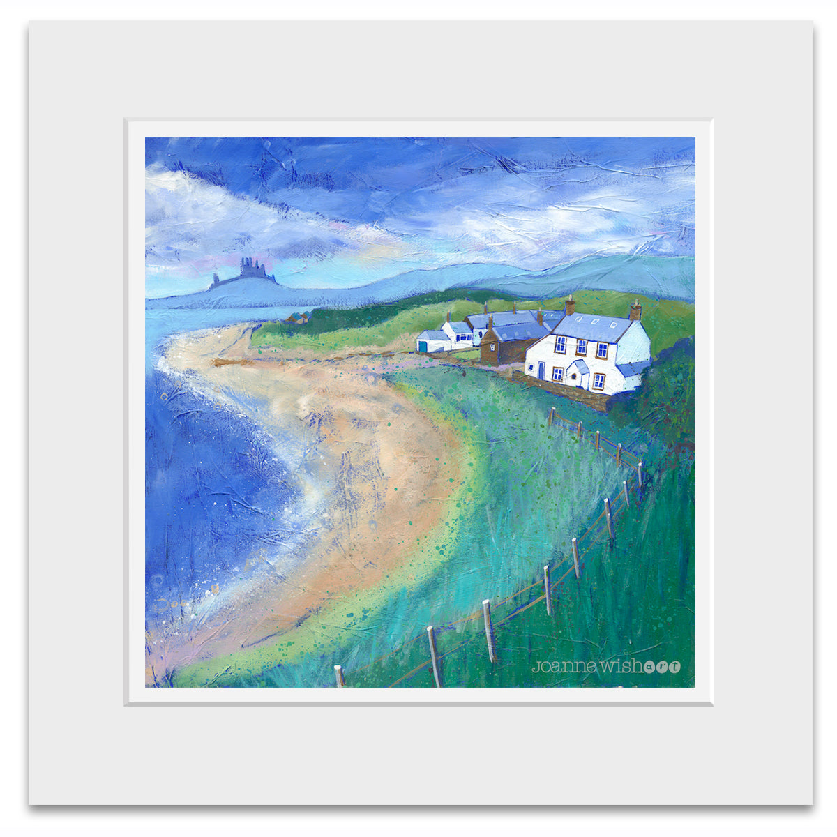 A mounted print of Low Newton beach in northumberland featuring the white national trust cottages on a summers day.