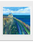 A mounted print of the Bathing house on the northumberland coastal path.