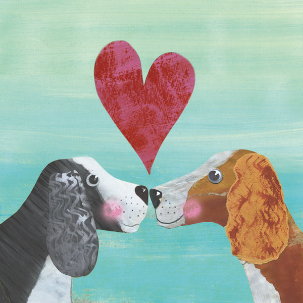 Two friendly spaniel dogs face each other blushing with a big textured red heart between them. One dog has black fur while the other has auburn. Both dogs have a white face and chest and curly haired ears. The background is textured blue and cream. 