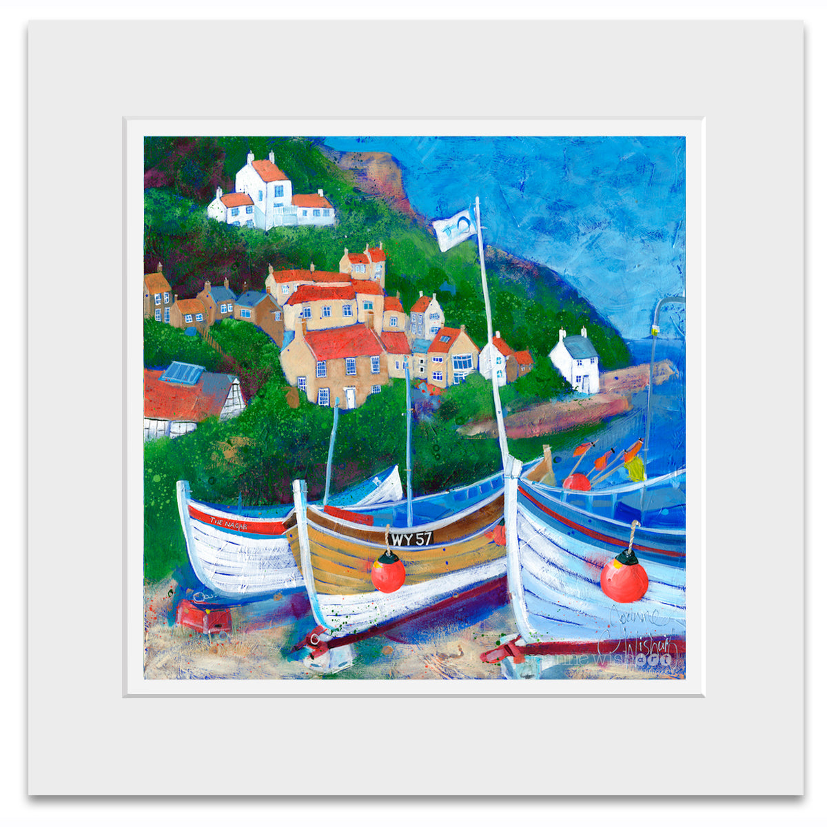 A mounted print of Runswick Bay.