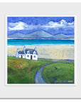 a mounted fine art print of the Isle of Sky featuring a white stone cottage.