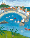 A colourful picture of st ives harbour in cornwall featuring colourful cottages, boats and a turquoise sea.