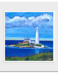 A mounted print of St Mary's island with a bold blue sea and sky.