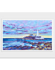 A mounted print featuring the coastal landscape of St Mary's Lighthouse with a lavender evening sky hanging over the north sea. Pools of water glisten in the rocks.